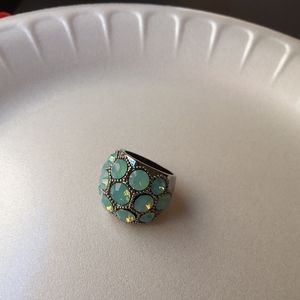 Ring green stones size 7 silver tone.